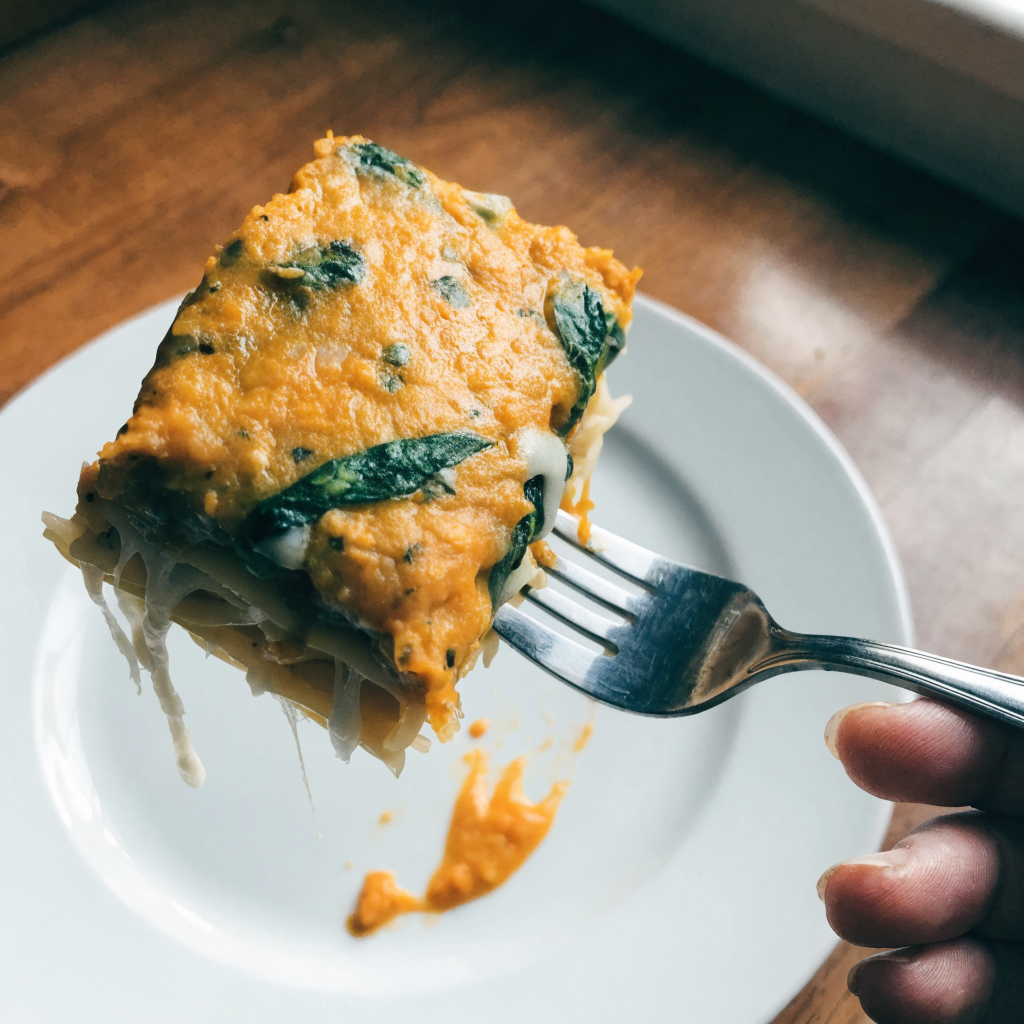 Close-up of pumpkin spinach lasagna with ricotta